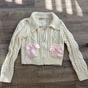 Cream jacket with pink bows